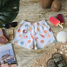 Load image into Gallery viewer, Flatlay of Relaxed Fit Shorts for Babies and Toddlers. Beach themed print including Coconuts, beach ball, ice lollies, sun, shell and surf board in summery muted colours.