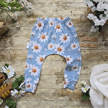 Load image into Gallery viewer, Daisy Chain Toddler Harem Leggings featuring an elastic waistband for a comfortable fit, with a light blue base and white daisy print.