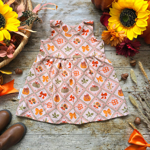 Baby and Toddler Girl Pinny Dress, Patchwork Style Print with Pumpkins, Bows and Sunflowers. Cottage Core Autumn Dress