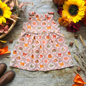 Baby and Toddler Girl Pinny Dress, Patchwork Style Print with Pumpkins, Bows and Sunflowers. Cottage Core Autumn Dress