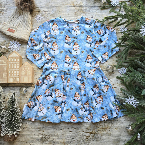 Girls Winter Dress with Long Sleeves. Snowmen, Snowflakes on a crisp blue background