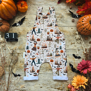 Baby and Toddler Dungarees, with party skeletons on. Gender Neutral Earthy Halloween Outfit