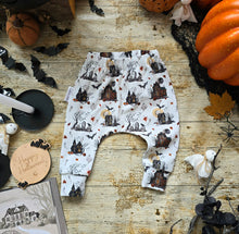 Load image into Gallery viewer, Baby Harem Pants in a Haunted House Halloween Themed Print. Leegings have an off white background and include bats, ghosts, pumpkins and autumn leaves
