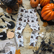 Load image into Gallery viewer, Halloween-themed unisex toddler leggings, with haunted houses, bats and ghost. 